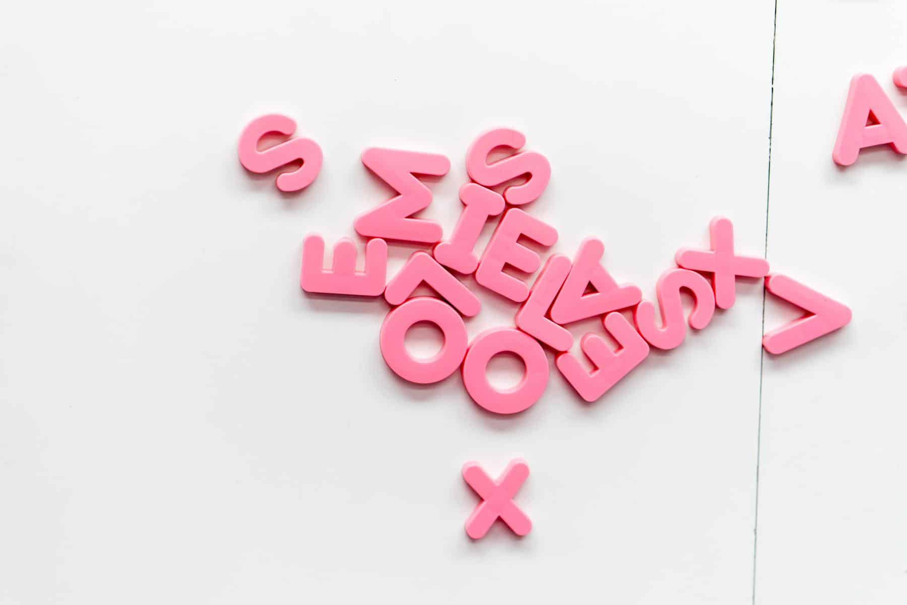 Pink letters on wall