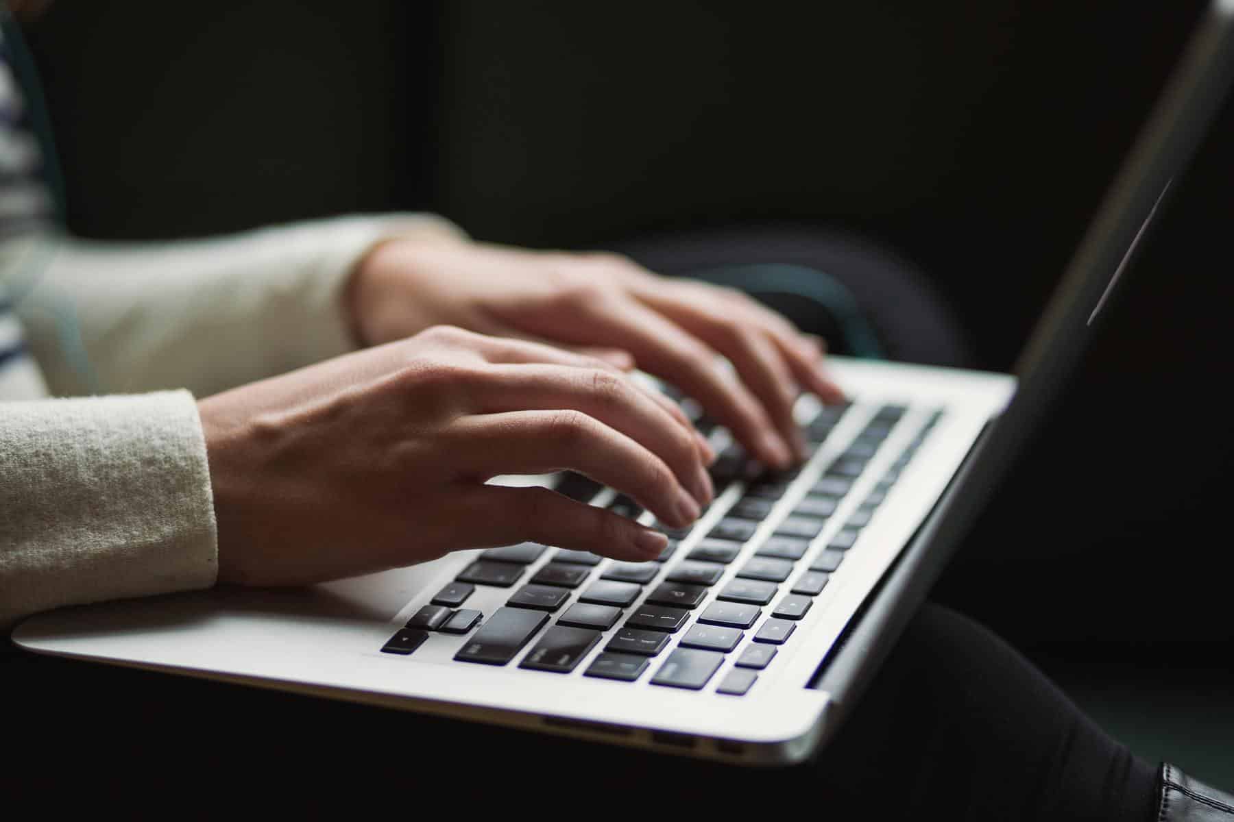 Person using laptop to write