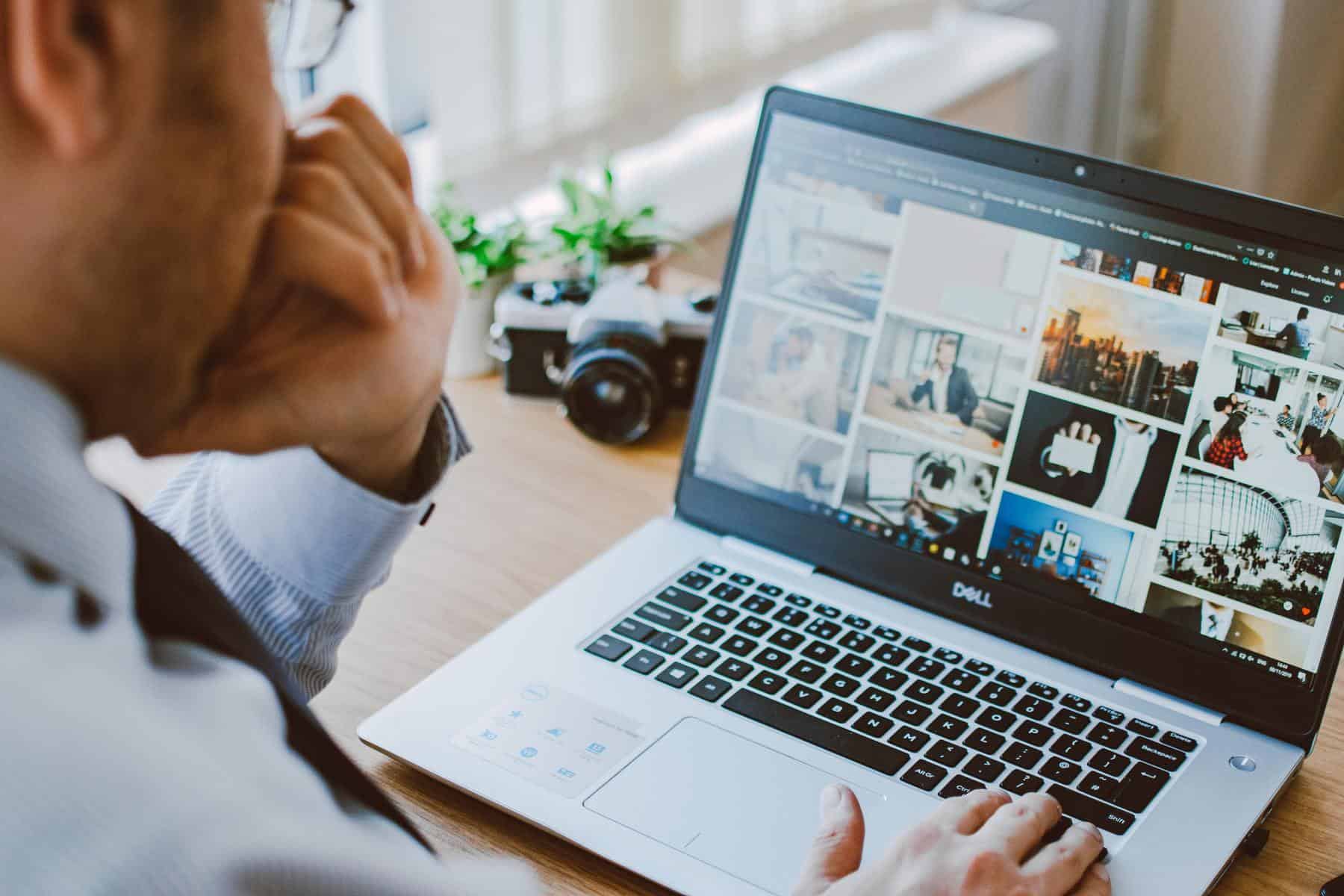 Man looking at photography website