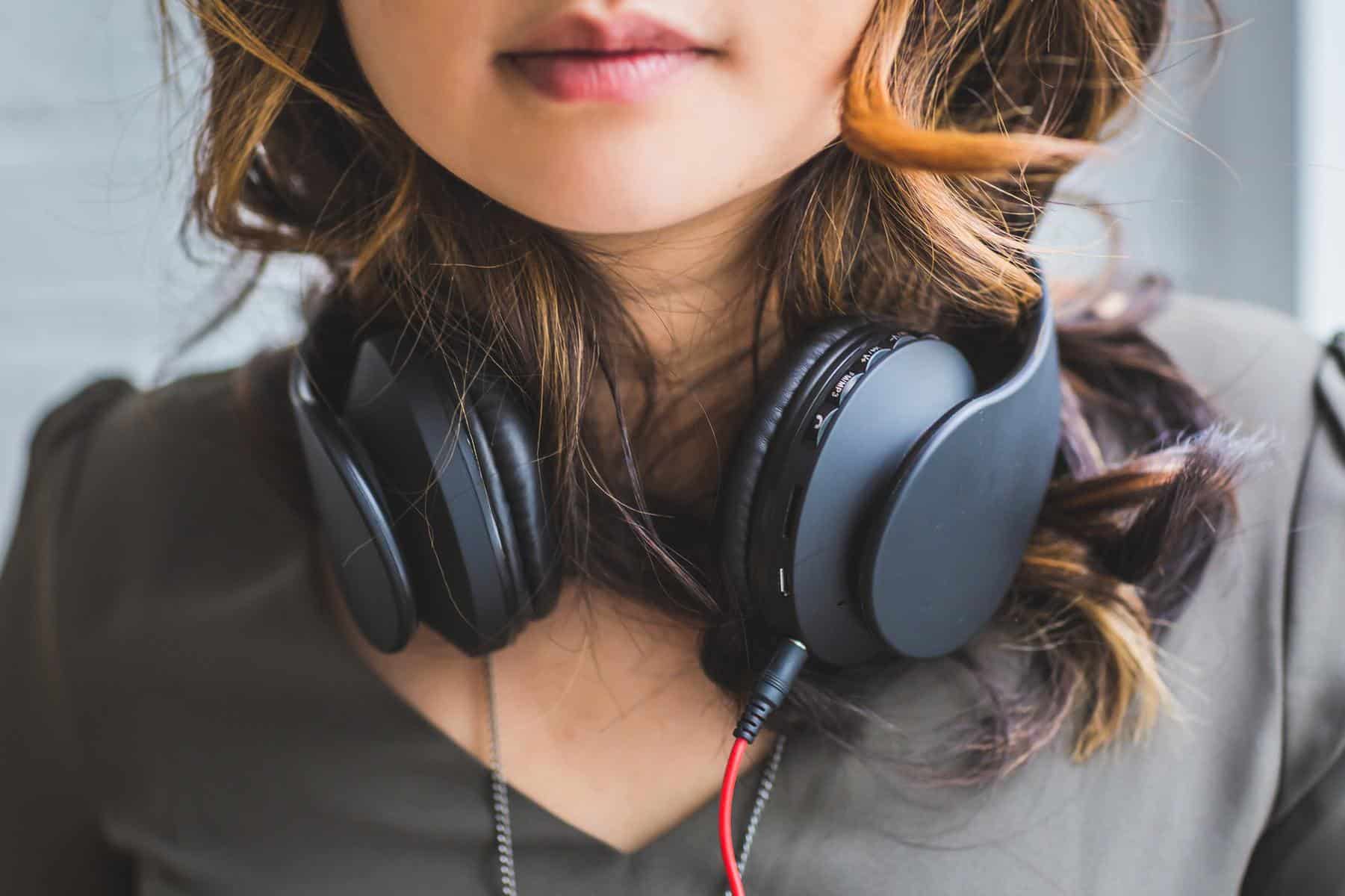 Woman with headset around neck