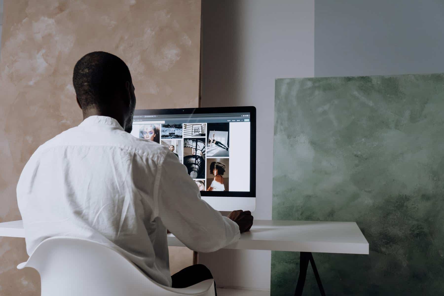 Man looking at images on desktop