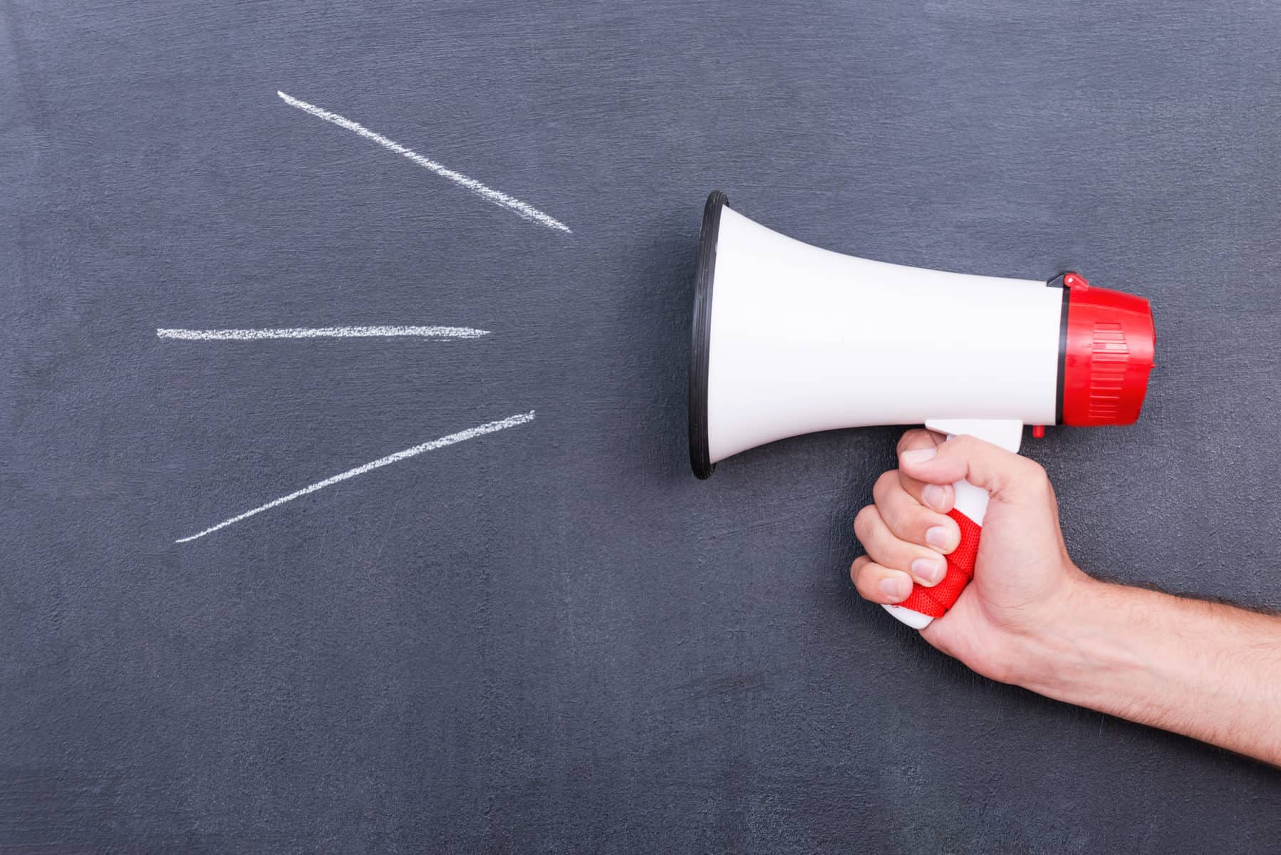 Megaphone in front of blackboard