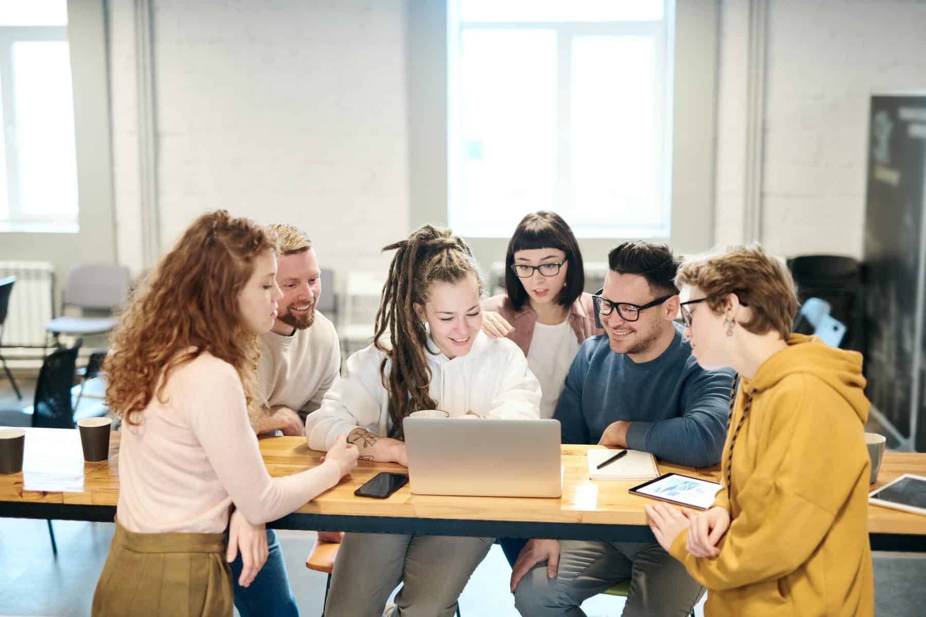 Team looking at laptop together